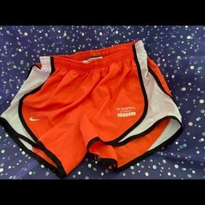 Junior’s Nike orange shorts. Size small